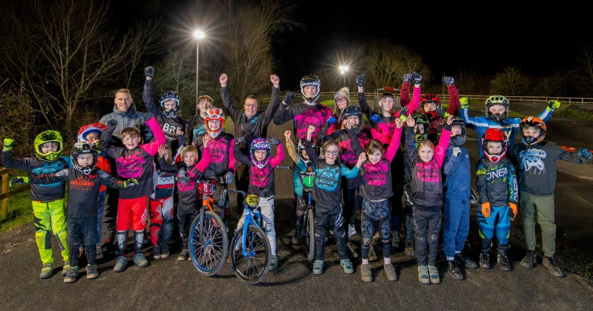 Group of young people from Burnham BMX Club waving